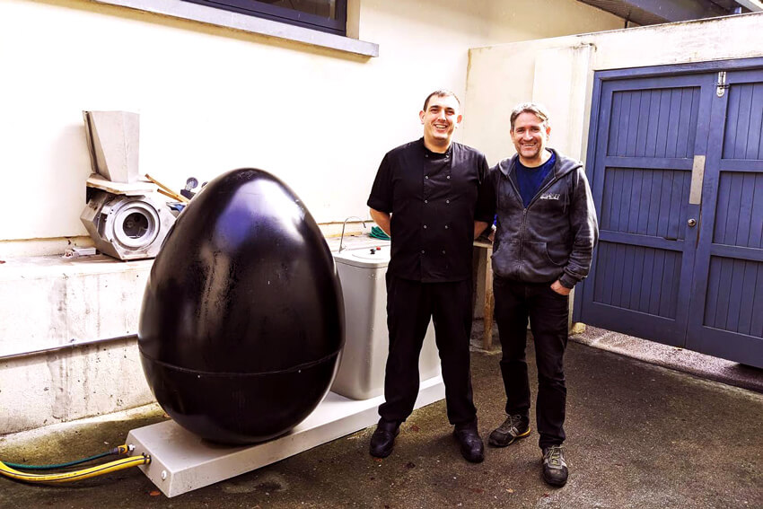 Bandon Grammar head chef Shane with MyGug founder Kieran, standing next to a MyGug anaerobic digestor